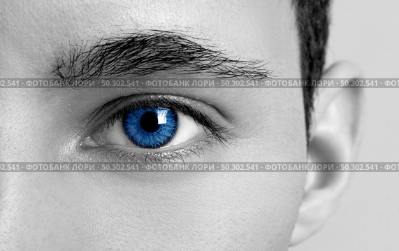 Close-up portrait of a young man with blue eyes - OBS: model use lens contact. Стоковое фото, агентство Ingram Publishing / Фотобанк Лори