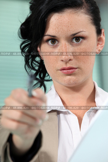 Close-up shot of a woman pointing her pen. Стоковое фото, агентство Ingram Publishing / Фотобанк Лори