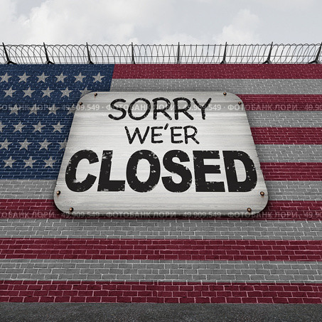 Closed american border wall concept as a security barricade with a sign with a message and flag of the United States as a customs and country boundary with barbed wire as a symbol for national protectionism as a 3D illustration. Стоковое фото, агентство Ingram Publishing / Фотобанк Лори