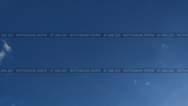 Clouds are floating across the sky. Light Blue sky almost without clouds, rare clouds quickly move across the sky. Cumulus clouds quickly appear out of nowhere and quickly dissolve in the air. Стоковое видео, видеограф Andrew_Swarga / Фотобанк Лори