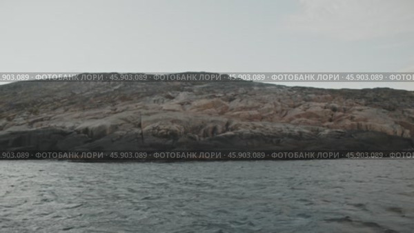 Coastline of steep cliffs overlooking cold Arctic Ocean. Teriberka, Russia, Kola Peninsula. Редакционное видео, видеограф Strunov David / Фотобанк Лори