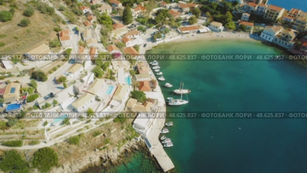 Colorful coastal village Asos with yachts and beach in a bay on Kefalonia island Greece. Стоковое видео, видеограф Igor Tichonow / Фотобанк Лори