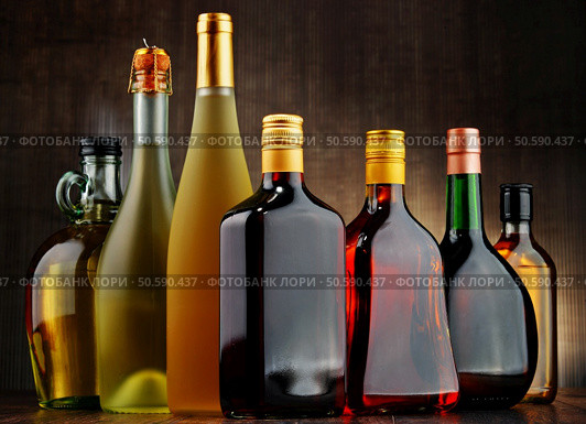 Composition with bottles of assorted alcoholic beverages. Стоковое фото, агентство Ingram Publishing / Фотобанк Лори