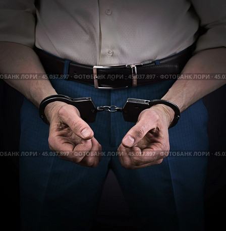Concept of economic crime. Businessman in handcuffs and with dirty hands. Стоковое фото, фотограф Дмитрий Кобзев / Фотобанк Лори