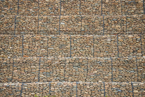 Construction and strengthening of roads from landslides. Stones in a metal mesh, gabions. Technologies in road construction. Стоковое фото, фотограф Наталия Кирсанова / Фотобанк Лори