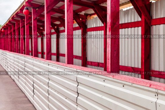 Construction Site With Vibrant Red Wooden Frames and Corrugated Walls for New Building Project. Стоковое фото, фотограф Aleksandr Golubev / Фотобанк Лори