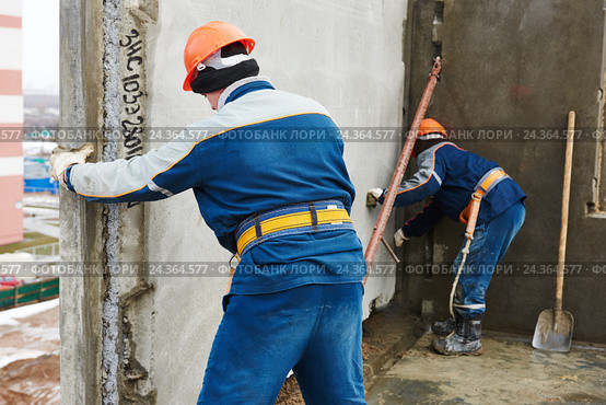 Construction worker. Builders concreter joiners at work. Стоковое фото, фотограф Дмитрий Калиновский / Фотобанк Лори