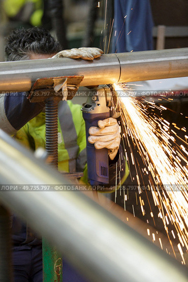 constructions worker welding with sparkles. Стоковое фото, агентство Ingram Publishing / Фотобанк Лори