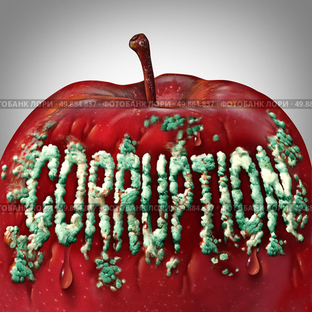 Corruption symbol and rotten to the core concept as mold or fungus shaped as text on an apple representing the criminal act of bribery and fraud as a legal metaphor for dishonest immoral behavior. Стоковое фото, агентство Ingram Publishing / Фотобанк Лори