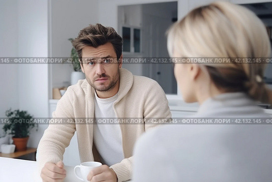 Couple conversation in kitchen over coffee, facing relationship difficulties and considering divorce, seeking solutions to reconnect and rebuild their bond. Стоковое AI-изображение, AI-художник Оксана Гильман / Фотобанк Лори