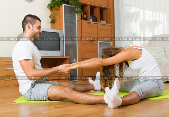 couple doing regular exercises together. Стоковое фото, фотограф Яков Филимонов / Фотобанк Лори