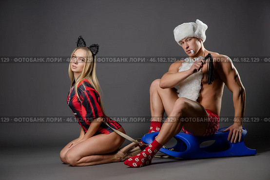 Couple engaged in playful roleplay with themed outfits and accessories. Стоковое фото, фотограф Гурьянов Андрей / Фотобанк Лори
