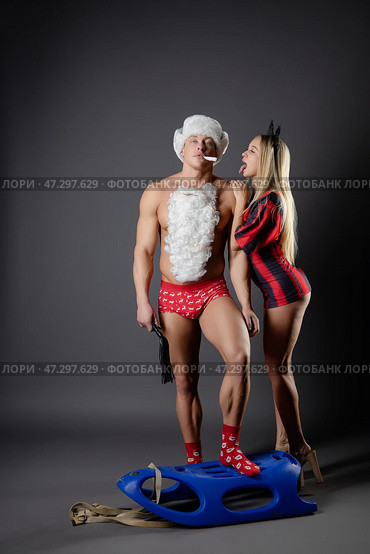 Couple engaging in playful roleplay at home with themed outfits and props. Стоковое фото, фотограф Гурьянов Андрей / Фотобанк Лори