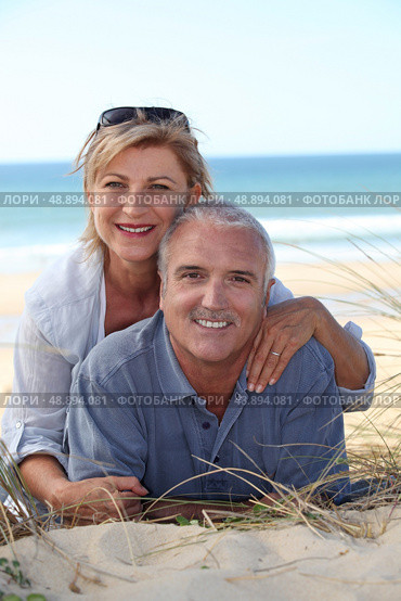 Couple on the beach. Стоковое фото, агентство Ingram Publishing / Фотобанк Лори