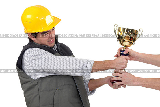 craftsmen fighting for a golden cup. Стоковое фото, агентство Ingram Publishing / Фотобанк Лори