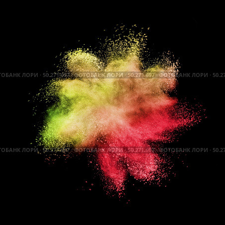 Creative chaotic powder explosion or splash in yellow and red colors on a black background with copy space.. Chaotic burst in yellow red colors on a black background. Стоковое фото, агентство Ingram Publishing / Фотобанк Лори