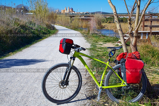 cycling tourism MTB bike in Ribarroja Parc de Turia with paniers and saddlebag. Стоковое фото, агентство Ingram Publishing / Фотобанк Лори