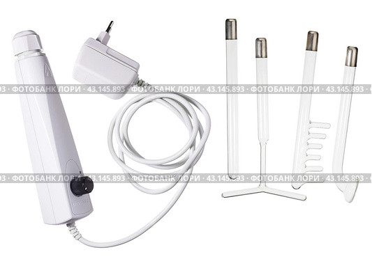 Darsonval isolated on white background, taking care of yourself at home . medical device for the treatment of acne, cellulite, hair at home and in Spa centers. close-up. Стоковое фото, фотограф Дмитрий Львович Алферов / Фотобанк Лори