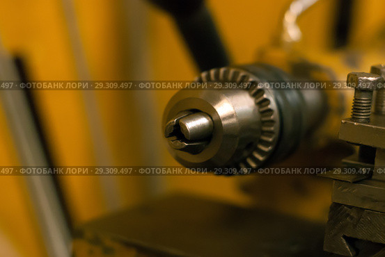 Detail of the lathe - clamping chuck - close up on a blurred background. Стоковое фото, фотограф Евгений Харитонов / Фотобанк Лори