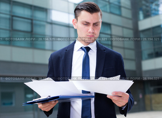 Director is examining documents before signing. Стоковое фото, фотограф Яков Филимонов / Фотобанк Лори