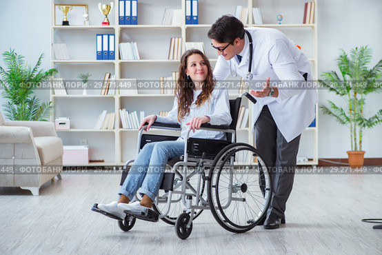 Disabled patient on wheelchair visiting doctor for regular check. Стоковое фото, фотограф Elnur / Фотобанк Лори