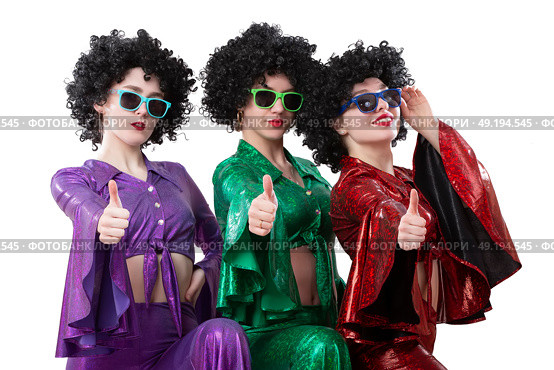 Disco style girls in colorful flared suits and African American wigs on a white background. Seventies or eighties style. Стоковое фото, фотограф Лазаренко Светлана / Фотобанк Лори