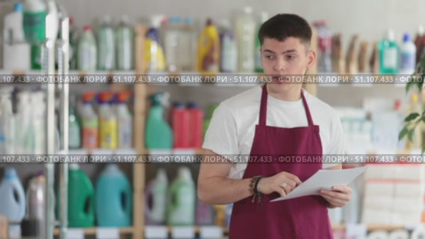 Disgruntled male salesman conducts an inspection of a hardware store. Стоковое видео, видеограф Яков Филимонов / Фотобанк Лори