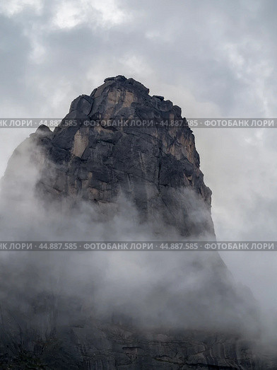 Dramatic deep dangers gorge with sharp sheer crags silhouettes. Стоковое фото, фотограф Саблин Станислав / Фотобанк Лори
