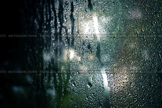drops on glass , window condensation , and the background for dark text , spray on the window. Стоковое фото, агентство Ingram Publishing / Фотобанк Лори
