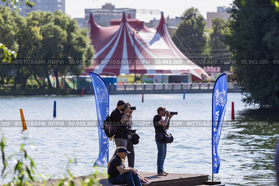 Dynamic sports photographers taking action shots at the Hydrofly-Fest 2025 Extreme Water Sports Festival in Moscow. Редакционное фото, фотограф Андрей Иванов / Фотобанк Лори