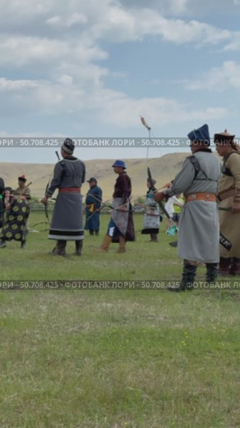 ELANTSY VILLAGE, IRKUTSK REGION, RUSSIA - July 5, 2025: Erdynskie Games are festival of nomadic peoples of Eurasia. Slow motion vertical video of archers compete in archery at sacred Erd Mountain on Baikal Lake. Редакционное видео, видеограф Виктория Катьянова / Фотобанк Лори