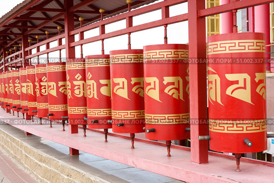 Elista, capital of Republic of Kalmykia, Russia, July, 4, 2025: Prayer drums of khurul, Buddhist temple Golden Abode of Buddha Shakyamuni, largest Buddhist temple in Europe. Редакционное фото, фотограф Екатерина Топорова / Фотобанк Лори