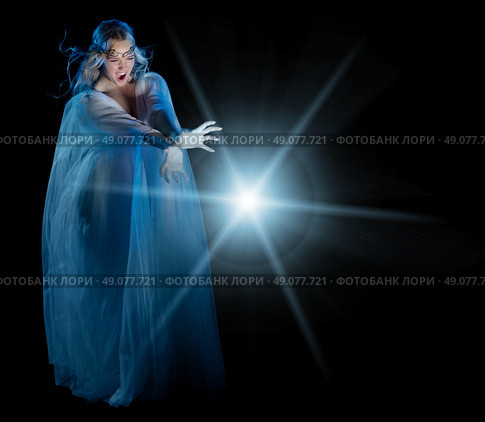 Elven conjures girl isolated on black. Стоковое фото, агентство Ingram Publishing / Фотобанк Лори