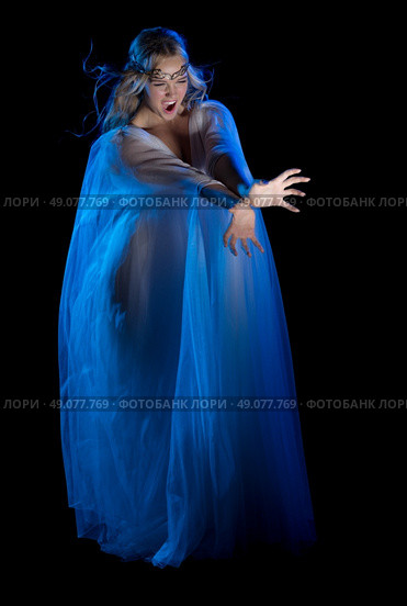 Elven conjures girl isolated on black. Стоковое фото, агентство Ingram Publishing / Фотобанк Лори