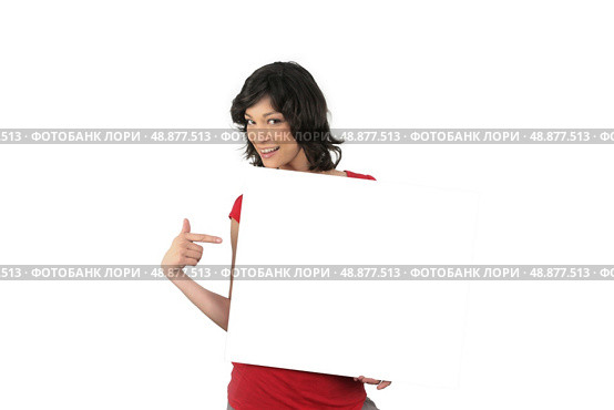 Enthusiastic woman pointing to a blank sign. Стоковое фото, агентство Ingram Publishing / Фотобанк Лори