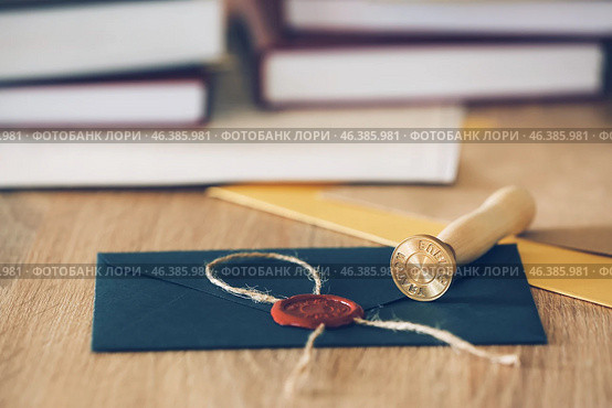 Envelope with notary public wax seal on table. Стоковое фото, фотограф Pixel_shot / Фотобанк Лори