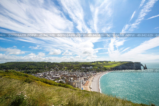 Etretat village, its bay beach and Aval cliff landmark. Aerial view. Normandy, France. Стоковое фото, агентство Ingram Publishing / Фотобанк Лори