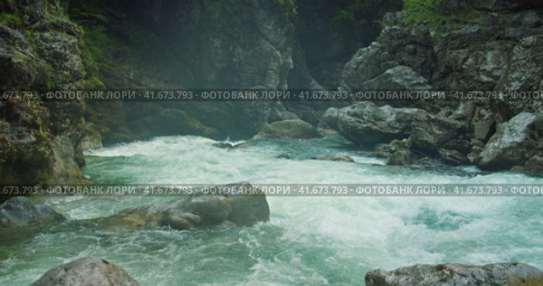 Evaporation over a cold mountain river with clear water in rocky gorge. Summer nature landscape. Стоковое видео, видеограф Igor Tichonow / Фотобанк Лори