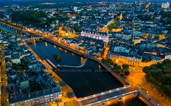 Evening aerial view of Laval with buildings, river Mayenne and old bridge. Стоковое фото, фотограф Яков Филимонов / Фотобанк Лори