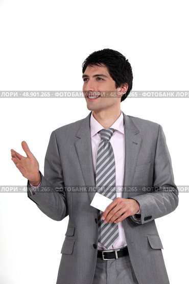 Executive offering a handshake and business card. Стоковое фото, агентство Ingram Publishing / Фотобанк Лори