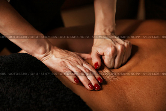 Experience the Soothing Touch of Therapeutic Massage in a Tranquil Indoor Setting for Relaxation. Стоковое фото, фотограф Aleksandr Golubev / Фотобанк Лори