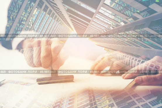 exposure image, A Person’s Hand Stamping With Approved Stamp On Document At Desk. Стоковое фото, агентство Ingram Publishing / Фотобанк Лори
