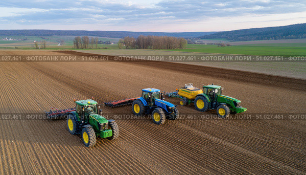Farmers working on field with tractors and agricultural machinery. Стоковое AI-изображение, AI-художник Юрий Поздников / Фотобанк Лори