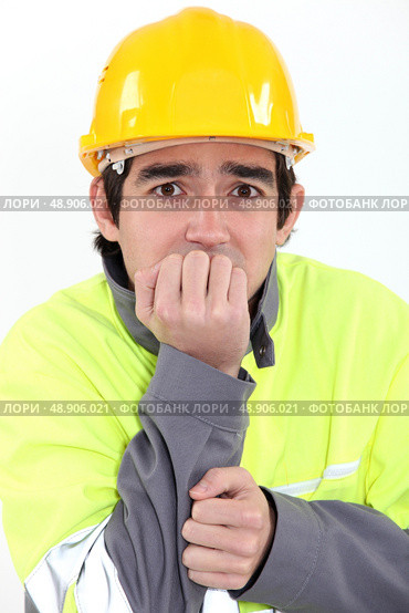 Fearful young worker. Стоковое фото, агентство Ingram Publishing / Фотобанк Лори