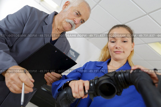 female apprentice holding a piece. Стоковое фото, агентство Ingram Publishing / Фотобанк Лори
