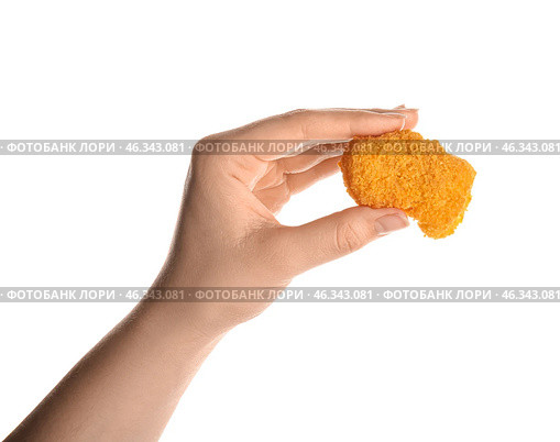 Female hand with tasty nugget on white background. Стоковое фото, фотограф Pixel_shot / Фотобанк Лори