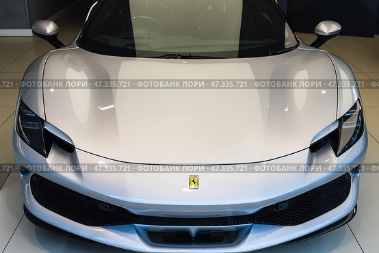 Ferrari Supercar Front Closeup Highlighting Aerodynamic Design. London, UK, 28 October 2023. Редакционное фото, фотограф Zydrius Tartenis / Фотобанк Лори