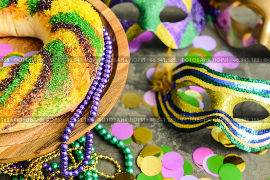 Festive cake for Mardi Gras (Fat Tuesday) holiday with decor on grey table. Стоковое фото, фотограф Pixel_shot / Фотобанк Лори