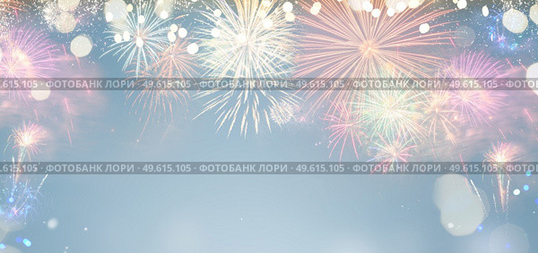 Fireworks colorful explosions on blue, festive background banner with copy space. Fireworks explosions on black. Стоковое фото, агентство Ingram Publishing / Фотобанк Лори