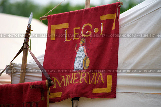 Flag of the 1st Roman Legion, historical reconstruction . The Times and Epochs Festival 2024 - Moscow, Russia, June 16, 2024. Редакционное фото, фотограф Андрей Журавлев / Фотобанк Лори